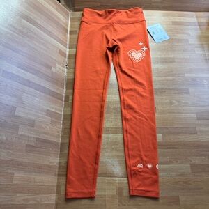 Athleta girl Simone chit chat tight leggings size 12 orange NWT